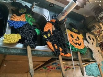 Vintage Haloween set of melted plastic popcorn yard stake figures from the 1970s. Four total Including ghost Jack O lantern witch on broom and black c