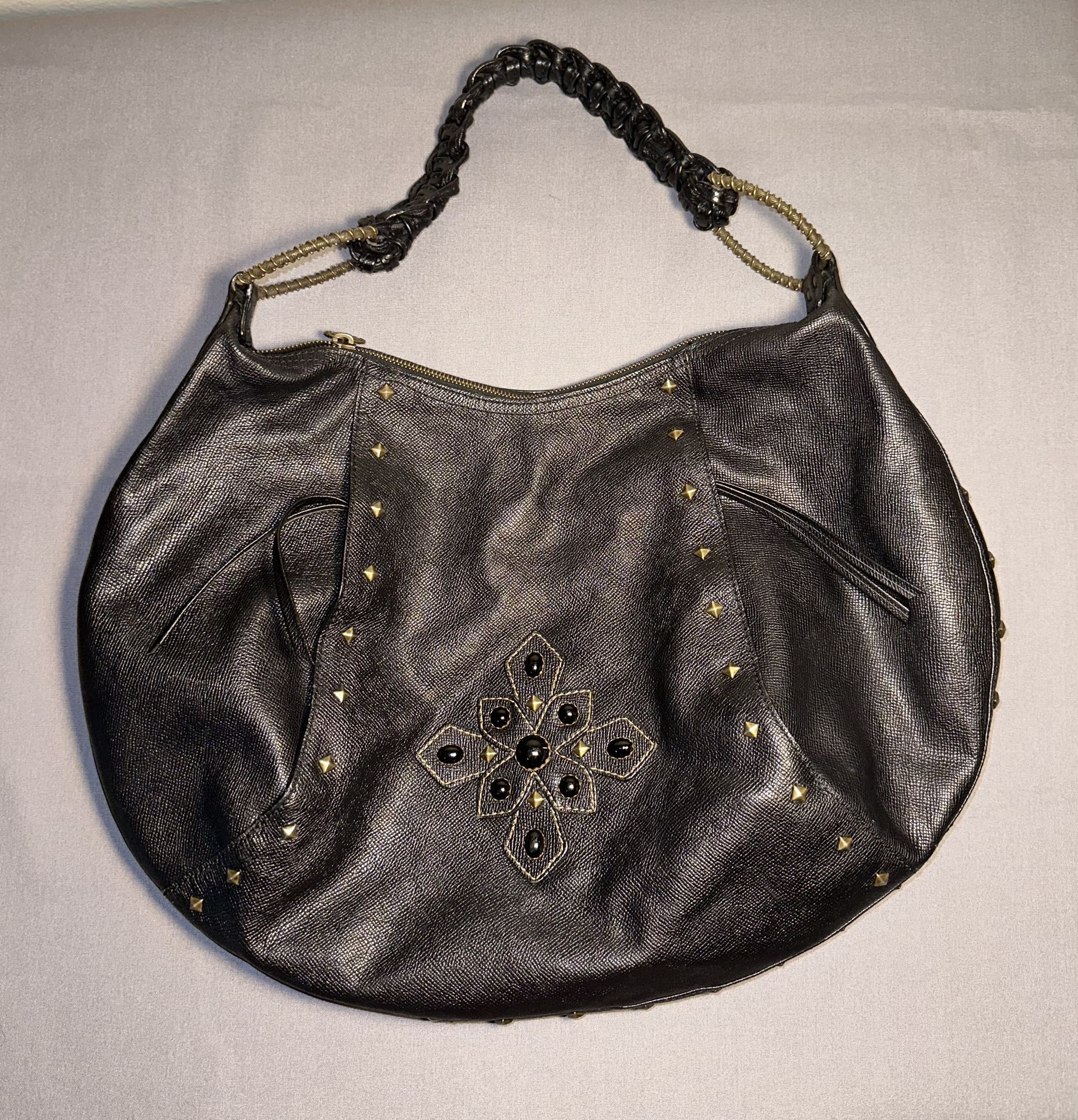 Eric Javits black leather studded ornate intricate hobo shoulder bag purse large.   20.75” x 13.75” x 0.75” with an 8” strap drop   Outside pockets  E