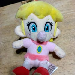 Baby Peach Plush Toy From The Super Mario Franchise.
