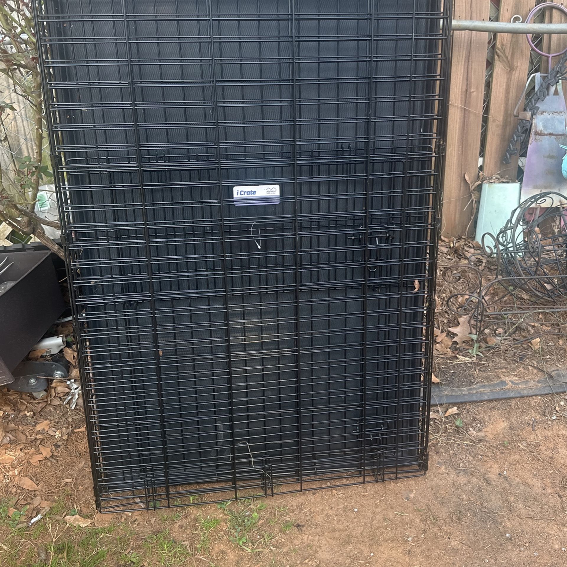 Large dog cage, new, and a medium dog cage