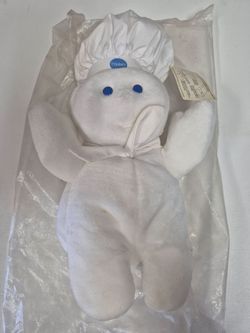 vintage Pillsbury Doughboy plush doll often found sealed in its original plastic packaging.