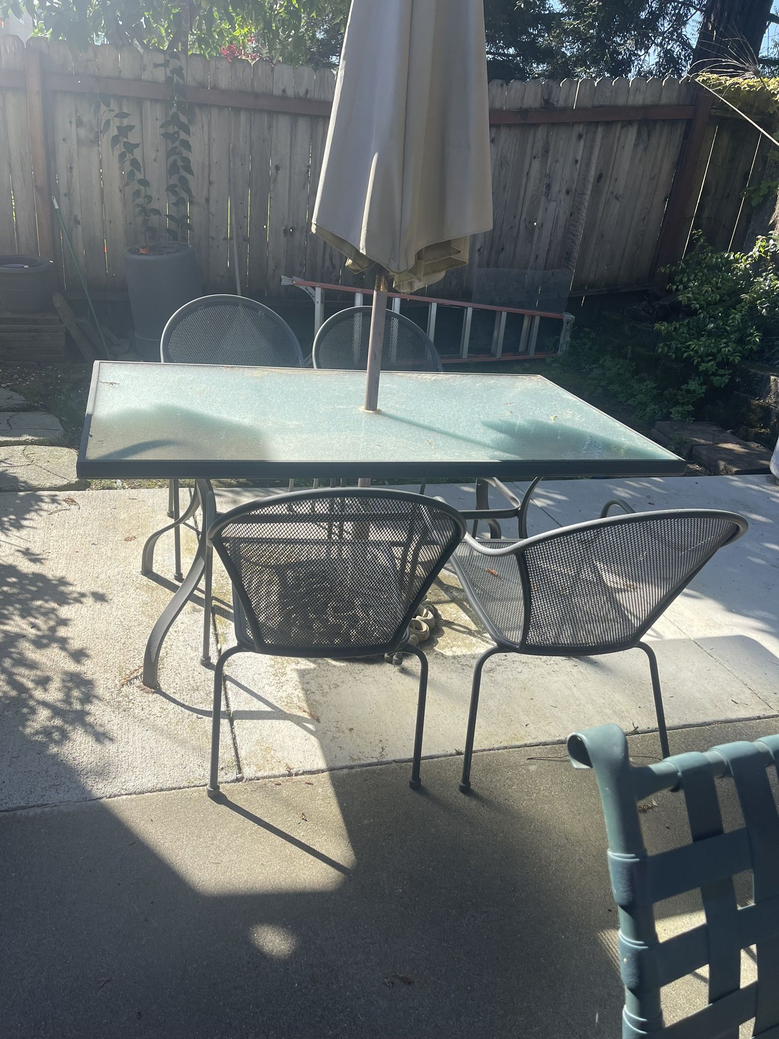 Nice Outdoor Table With Umbrella And Four Chairs