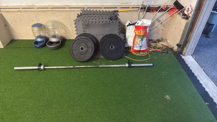 Olympic Lifting Bar, Two 15lbs Weights And Two 45lbs Weights 