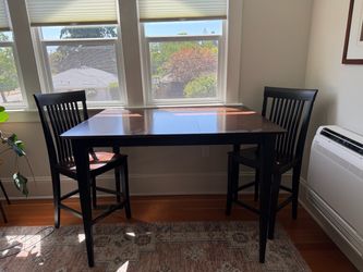 High top dining table with two chairs