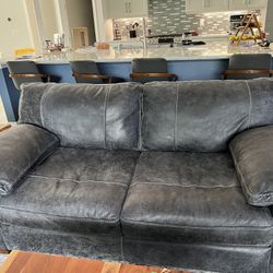 Two Leather Loveseats With ottoman
