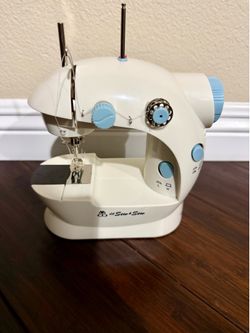 Mini Sewing Machine. Includes Foot Pedal, Power Adapter, 2 Bobbins, Operation Manual