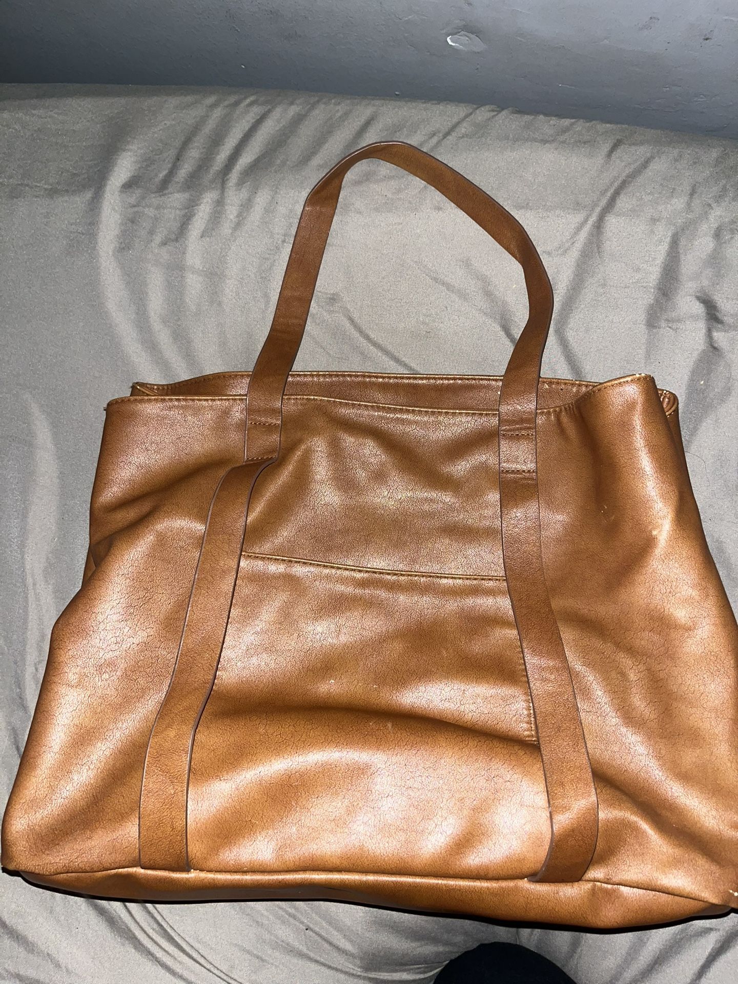 brown leather traveling bag