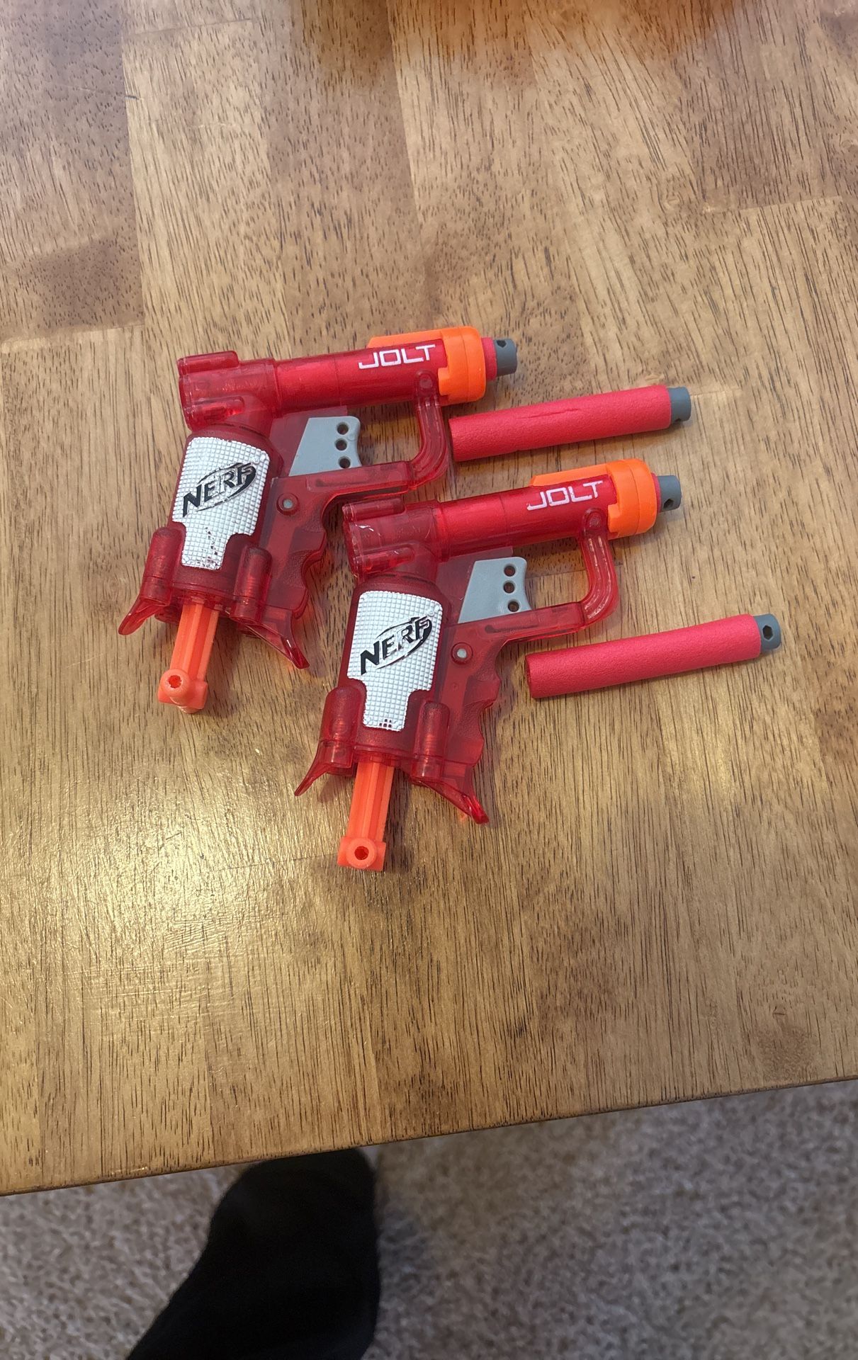 Two Small Nerf Guns With 4 Bullets