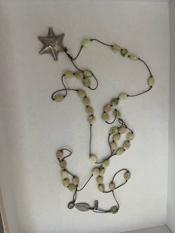 Long Beaded Necklace with Star Pendant / Paula Carlotta