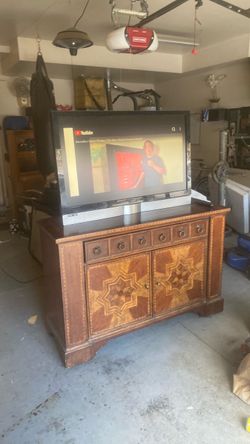 Antique cabinet and 47” tv