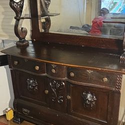 Large American Sideboard Penn Manufacturing Company. 67" x  55" x  22", 4  Metal Caster Wheels, Serpentine Draws, Relief Face On Cabinet Door. 