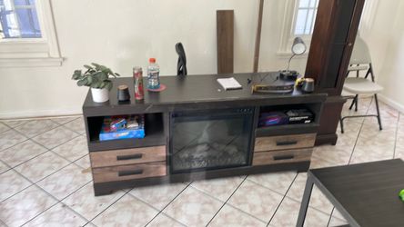 entertainment center with faux fireplace