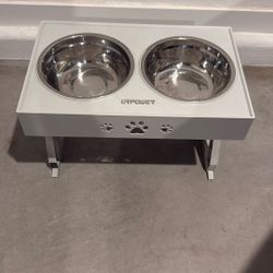 Selling my dog bowls goes up and down white medium size bowls