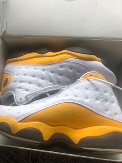 The sneakers in the image are the Air Jordan 13 Retro "Del Sol"