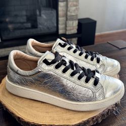 Women’s UGG Milo Metallic Silver Sneakers Leather. Size 7.5. Good condition see pictures for imperfections. Without box 