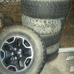 Five  Jeep Tires And Rims   700.00  Or Best Offer 