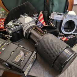 Canon AE-1 And  AT-1 Camera With Lenses