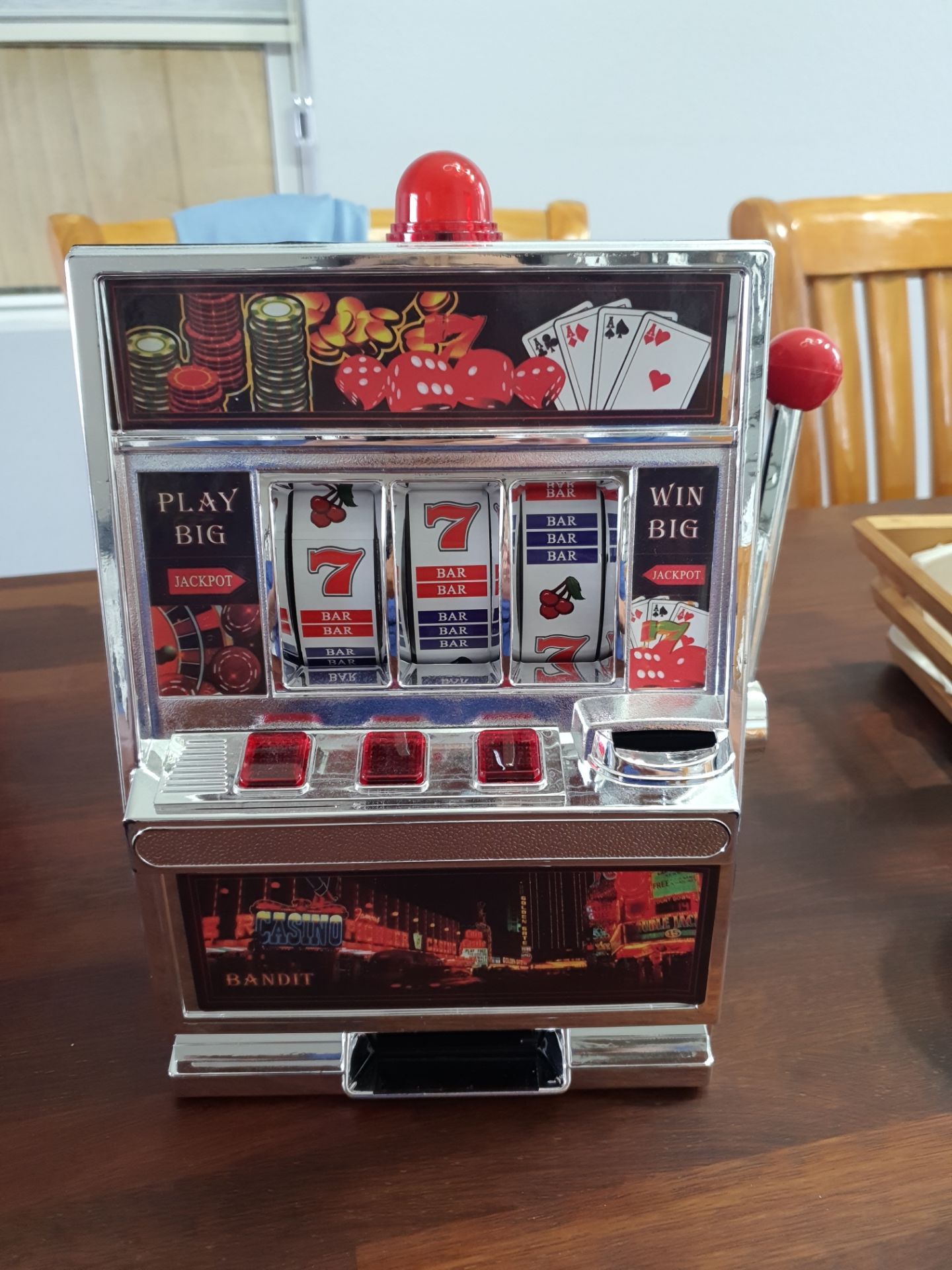 Slot machine toy and penny bank