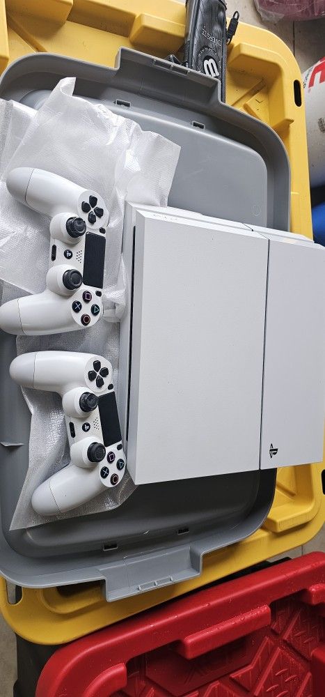 Sony PS4 with Games and 2 Remotes