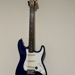 Squier Stratocaster With Two Cables And A 9 V Pedal Battery Cable