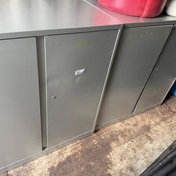 Silver metal cabinets with one shelf