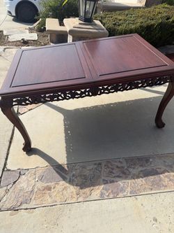 Free rosewood table with 4 chairs and 2 extenders