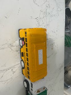 New- Not used - musical light garbage truck and school bus