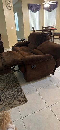 Brown microfiber swivel and rocking chair. Extremely comfortable