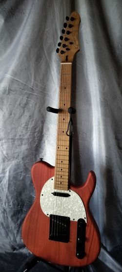 Brand new electric guitar with new gig bag cable and shoulder strap