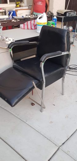 Shampoo chair, car seat, two strollers and a sink