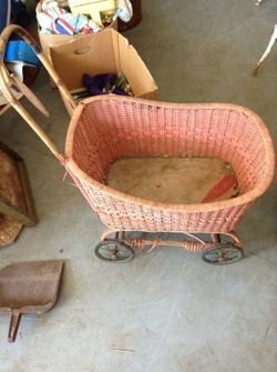 Pink wicker doll buggy
