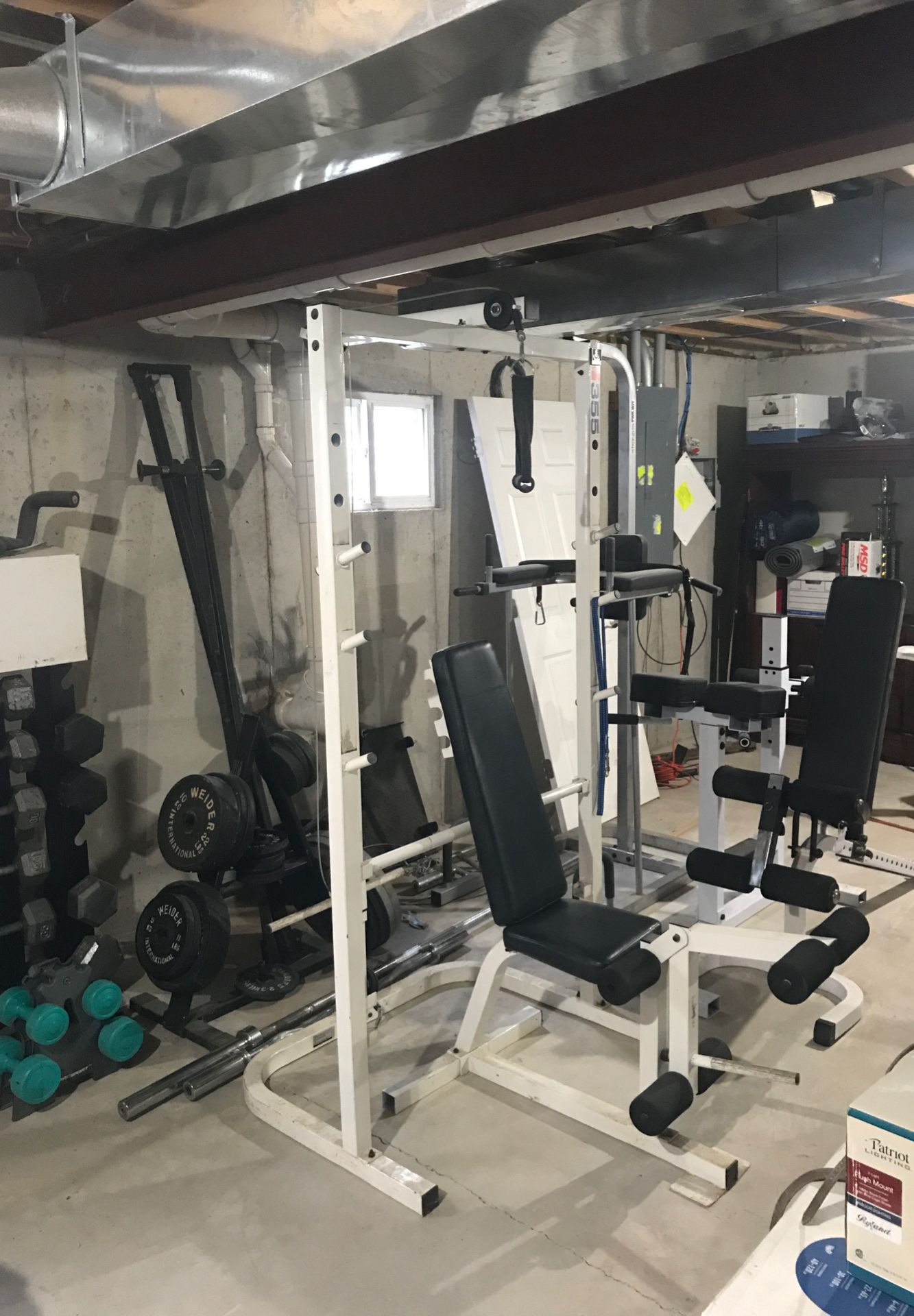 Home gym, 2 benches, back extension, abs and pull-up station hundreds of pounds of weight