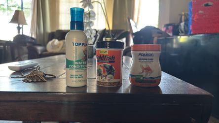 Fish flakes pellets and water conditioner