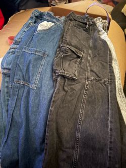 baggy cargo / flare Jeans size 8 through 10. Several tops size 8-10  short and long sleeve.  Whole Bag for 50 with a plush my melody purse.