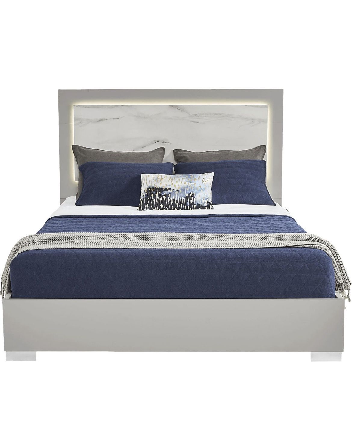 King Bed And A Dresser With A Mirror On