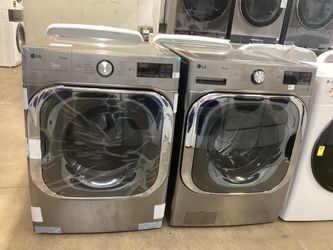 LG Mega Capacity Smart 5.2 cu.ft. Front Load Washer and 9.0 cu.ft. Electric Dryer w/TurboSteam. New Scratch and Dent