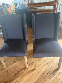 Pair of Grey Wingback Dining Chairs with Nailhead Trim