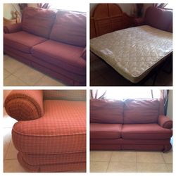 Sofa bed with red upholstery in good condition