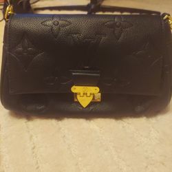 Authentic Black leather large embossed monogram Louie Vuitton bag in perfect condition