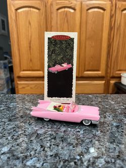 Hallmark Keepsake Christmas Ornament 1959 Pink Cadillac De Ville Classic Car.  Dated ornament 1996 on the back license plate.  Preowned the ornament i