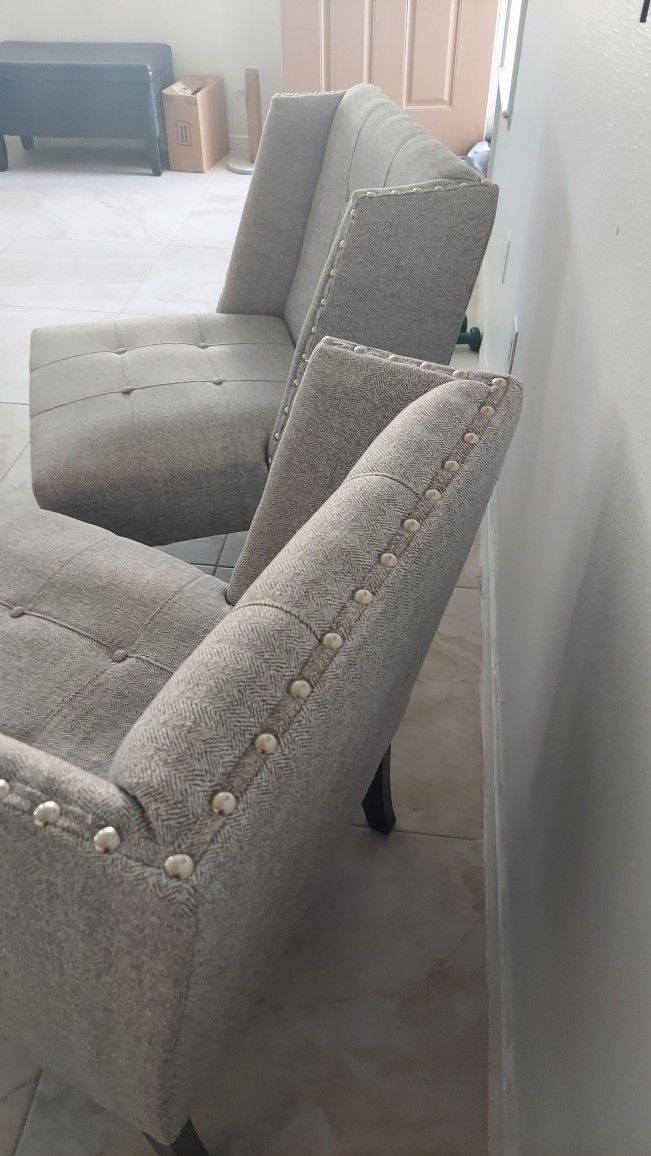 2 vonitos armchairs in good condition, light gray color with platinum buttons $65 each