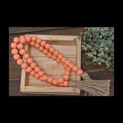 Coral Colored Beads On Tassel
