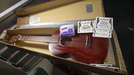 This is a Kala soprano mahogany ukulele with a natural satin finish.