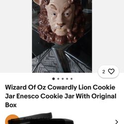 Decorative ceramic lion head with green crown