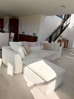 Warm-white L-shaped Sectional + Ottoman