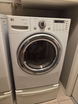 LG Steam front load w/ pedestals Electric washer & Dryer
