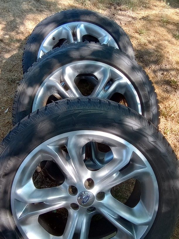 Four Tires And Rims And Lug Nuts