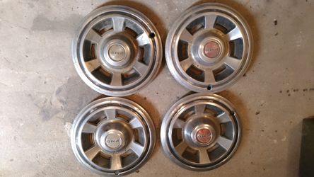 Four 1969 Pontiac 14 " wheel covers