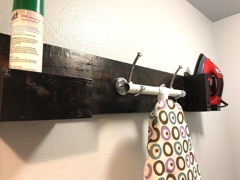 Custom made ironing board organizer shelf