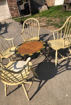 4 antique chairs and a patio table